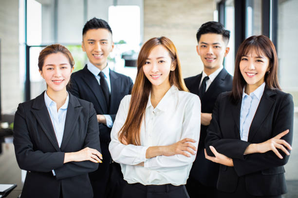 istock confident asian business team stands in office 1164246603