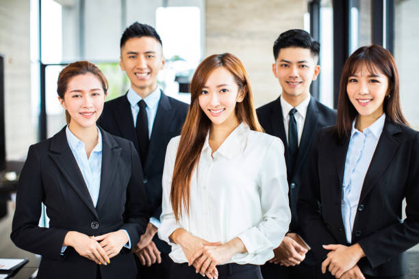 istock confident asian business team stands in office 1164246607