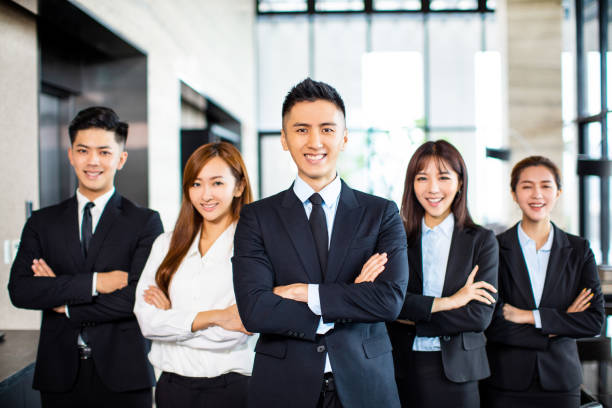 istock confident asian business team stands in office 1164246610