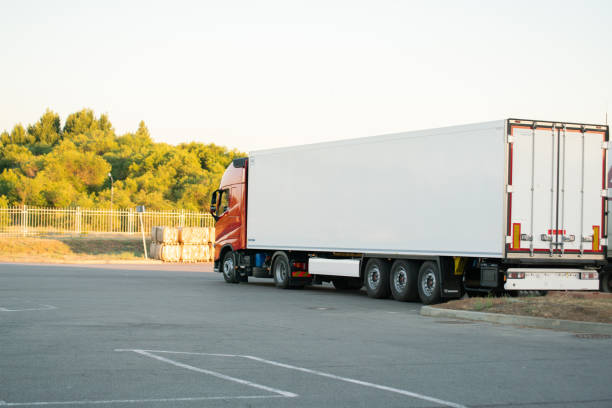 istock huge truck with wagon delivering some package outdoor 1164247730