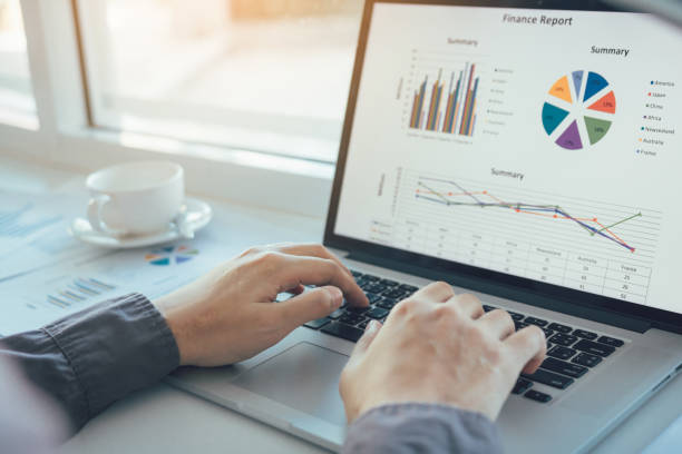 istock Investors are using laptop computers to analyze graphs in the morning. 1164248266