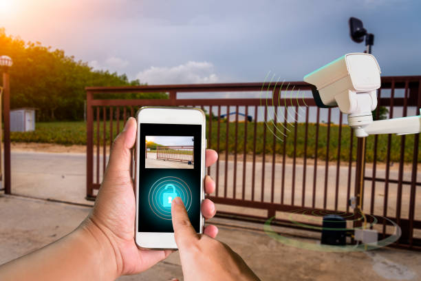 istock Signal of remote control when person open automatic gate at house for home security system with sunlight rays 1164249497