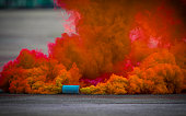 Colorful smoke bombs action in showing.