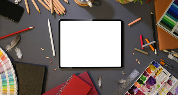 istock Overhead shot of artist's studio with blank screen tablet 1164250507