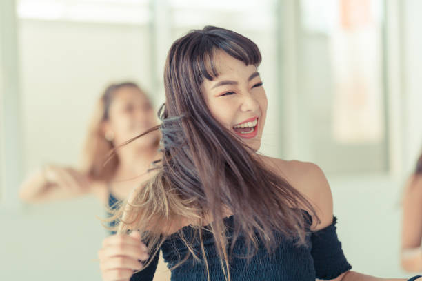 Young female dancers dance in studio