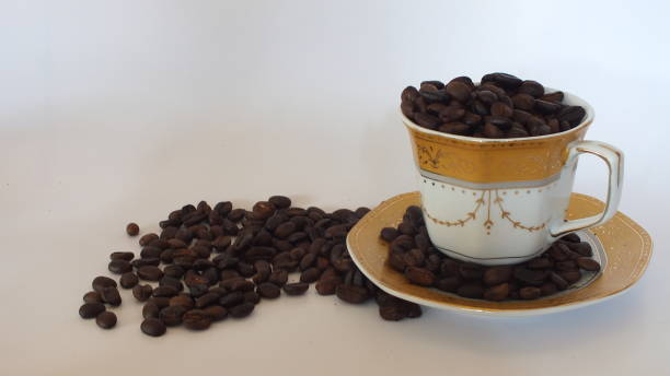 istock Coffee beans and a pretty cup 1164251555