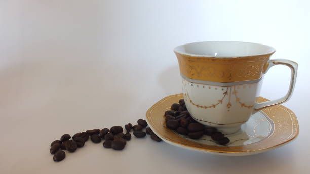 istock Coffee beans and a pretty cup 1164251563