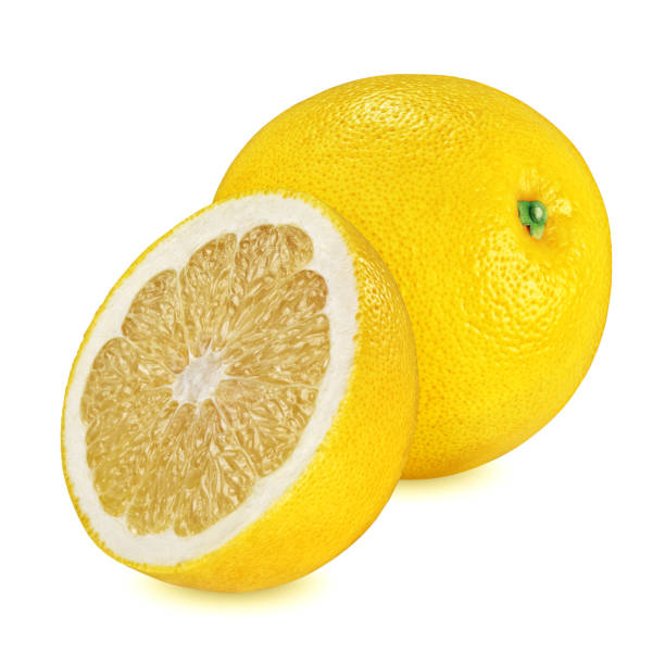 istock Whole and halved yellow grapefruit isolated on white 1164253216