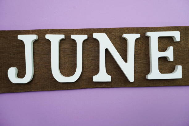 istock June alphabet letter with space copy on purple background 1164254062