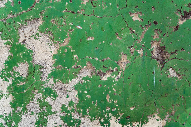 istock Peeling paint on the house wall background 1164256690