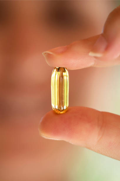 istock Woman holding medicine 1164268749
