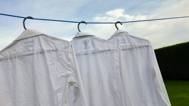 istock Men's shirts drying outside on washing line 1164269651