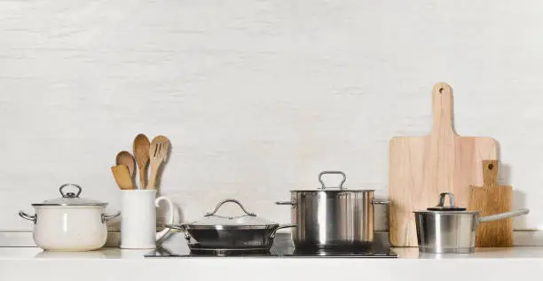 Photo of Kitchen utensils and stainless steel cookware