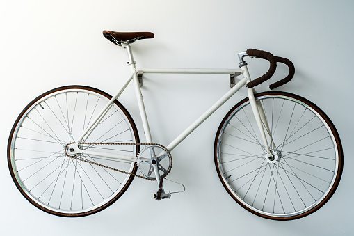 retro bicycle hanging on the white wall
