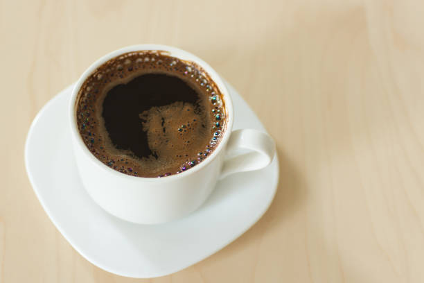 istock Coffee cup and saucer on a wooden table. 1164273460