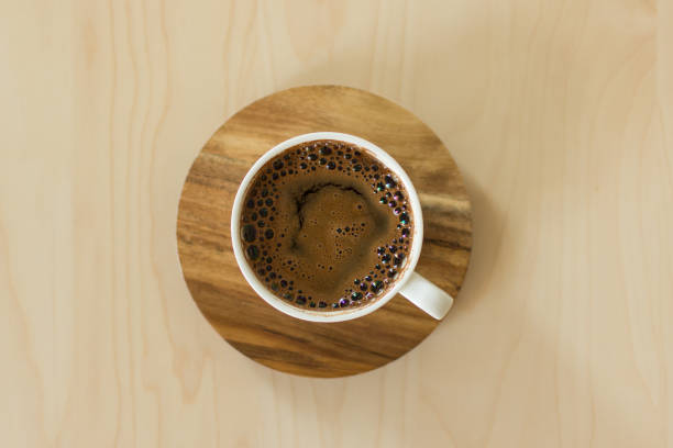 istock Coffee cup and saucer on a wooden table. 1164273462