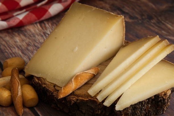 istock typical Spanish cheese and peaks of bread 1164275449