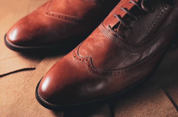 istock Stylish Men's shoes and suit 1164282330