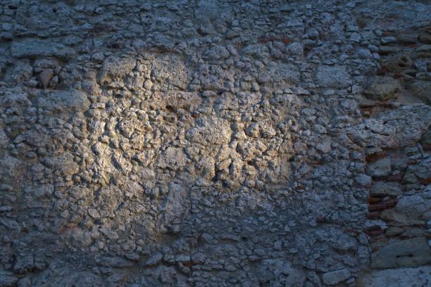 Closeup texture of ancient wall in Lisbon with sunlight stock photo