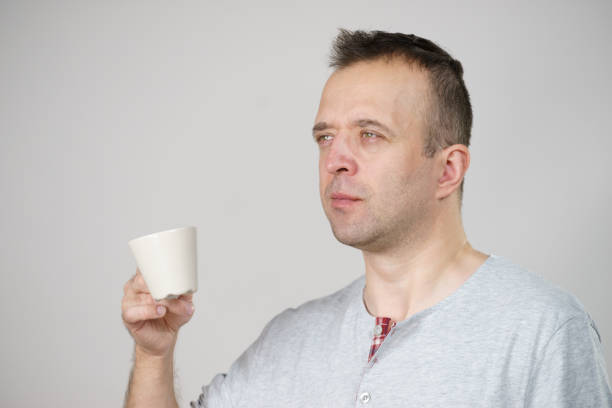 istock Tired man enjoying his coffee 1164291291
