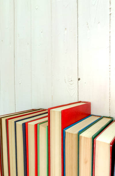 istock close up view of red novel book extends from another book 1164293421