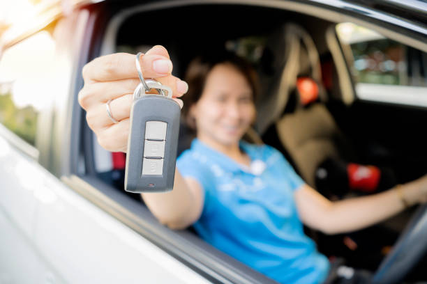 istock She is proudly holding the car keys. 1164303564
