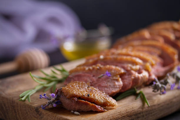 Duck breast on serving board. Duck breast fillet steak. Duck breast on serving board. Duck breast fillet steak confit stock pictures, royalty-free photos & images