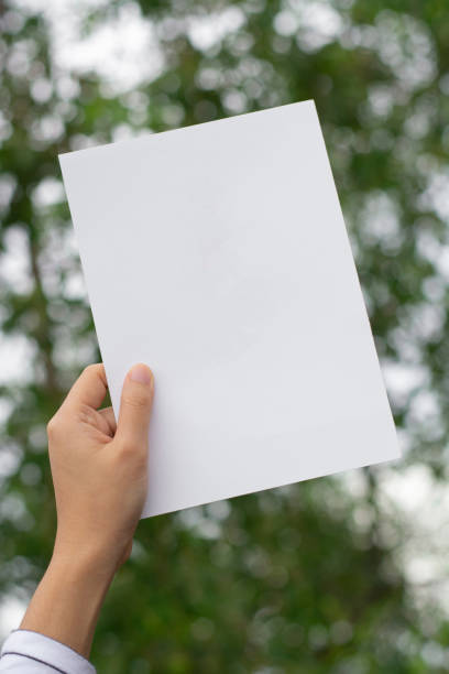 Woman holding paper blank