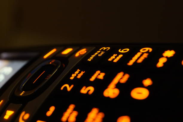 istock Glowing phone buttons in the dark macro shot, selective focusing 1164307206