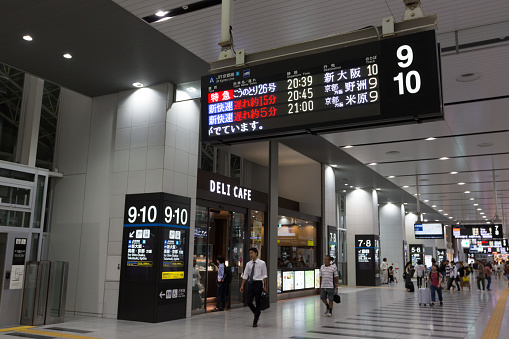 Osaka, Japan - August 28, 2018 : Commuters at the Osaka Station. This station is located in Umeda District, Kita-ku, Osaka, Japan. Kobe Line, Kyoto Line, Takarazuka Line, Osaka Loop Line, Yamatoji Line and Yumesaki Line are providing services in this station.