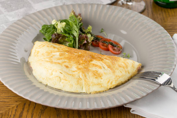 istock omelette and vegetables on grey plate on wooden table 1164309987