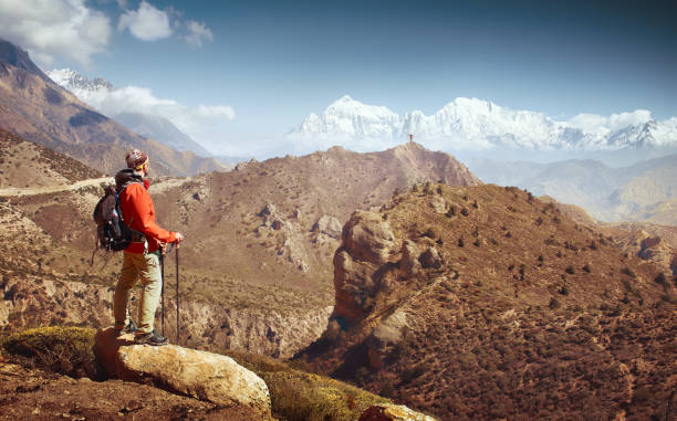 istock Hiker with backpack looks at the beautiful mountains in Upper Mustang. 1164312656