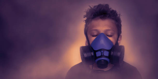 istock Young boy wearing gasmask, respirator portrait 1164316415