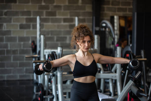 istock Handsome girl workout in gym 1164316637