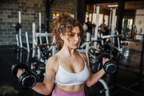 istock Handsome girl workout in gym 1164316669