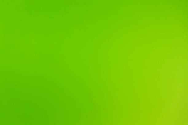 istock intensive neon green background at a wall 1164316801