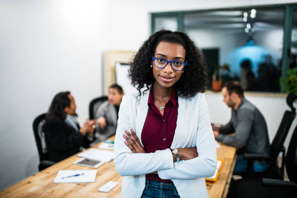 istock Confident Afro business woman at co-working space 1164319784