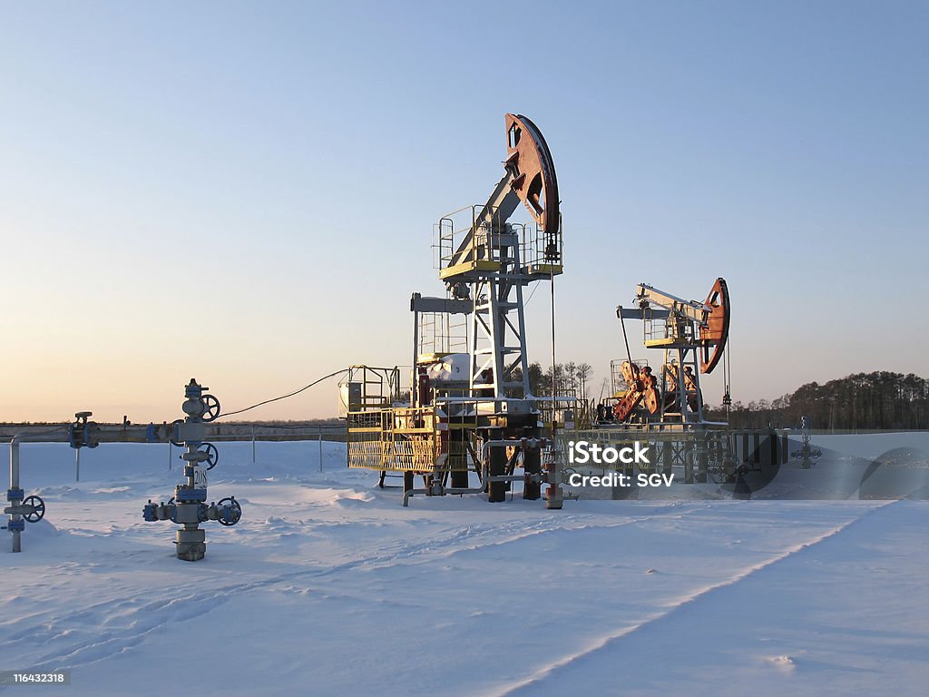 Extraction 2 Oil pump jack in work. Oil industry in West Siberia. Siberian frost in sunny day. Art And Craft Stock Photo