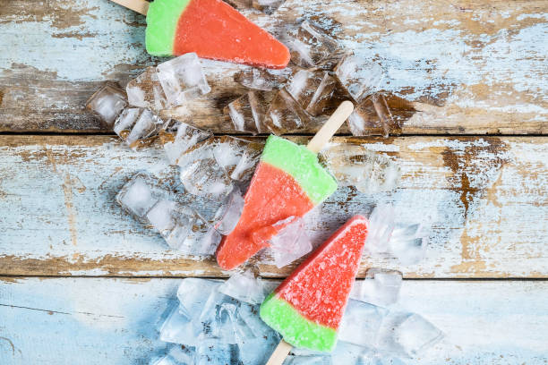 istock Ice cream sticks on a wooden background 1164326771