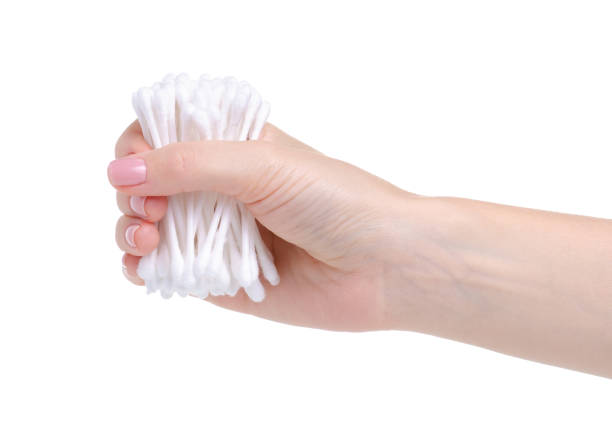 istock cotton swabs for cleaning ears in hand 1164330272