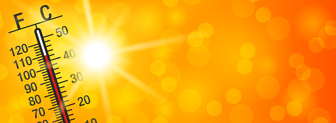 Summer sun with a thermometer on a yellow and orange bokeh background