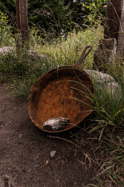 istock Rusted frying pan at road head 1164334574