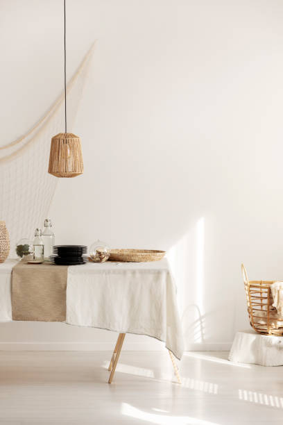 istock Bright white living room with table in the center 1164336037