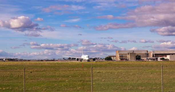 istock Airplane On Runway At Airport Against Sky 1164337196