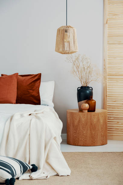 istock Wicker chandelier in classy bedroom interior in Scandinavian style 1164337854