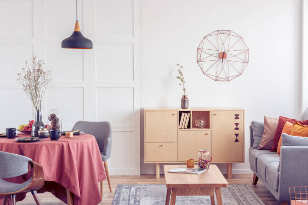 istock Vintage wooden coffee table and commode in elegant living room interior with grey couch 1164338319