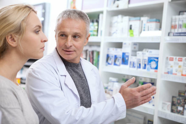 istock Charming young woman shopping at pharmacy 1164339112