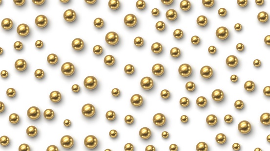 Golden balls scattered on white background