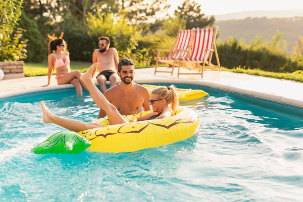istock Couple at the swimming pool 1164339751