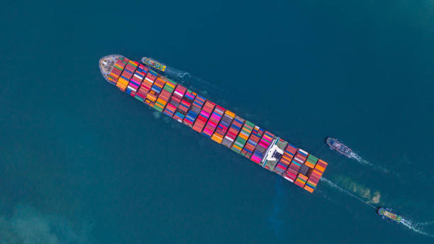 istock Container ship carrying container aerial view, Business import and export logistic and transportation of international by container ship in the open sea, with copy space. 1164340772